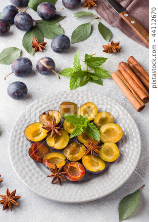 Fresh berries plums in the context of cooking  44112670