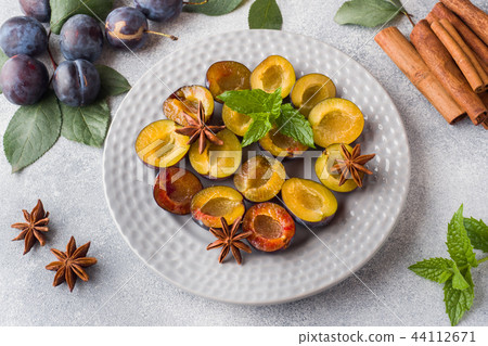 Fresh berries plums in the context of cooking  44112671