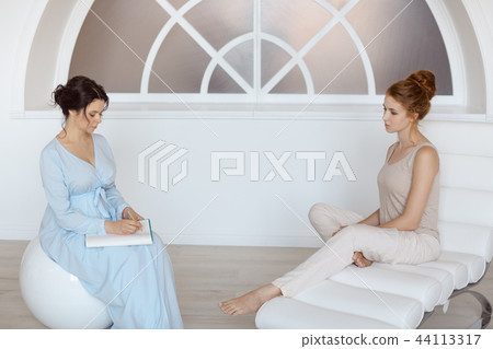 Psychologist having session with her patient in office Psychologist having session with her patient in office 44113317