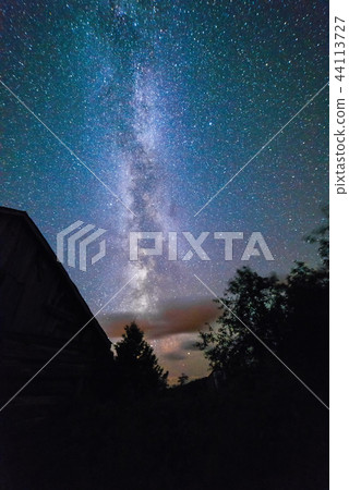 Old Barns with starry night sky with clouds and milky way 44113727