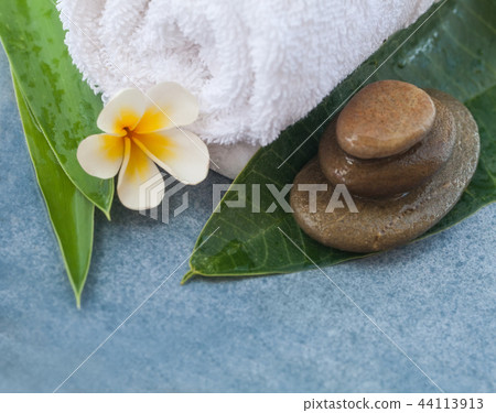 spa tropical set for massage on blue background spa tropical set for massage on blue background 44113913