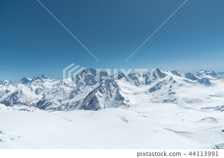 Winter snow covered mountain peaks in Caucasus. Great place for winter sports 44113991