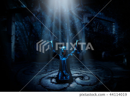 Witch in night forest with ray of light ver 44114019
