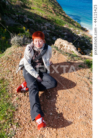 Happy smiling redhead women on Gozo, Malta. Happy smiling redhead women on Gozo, Malta. 44115425