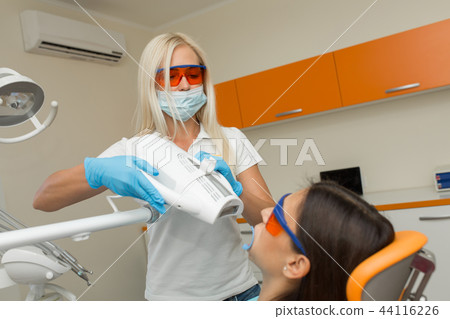 teeth whitening by dental UV whitening 44116226