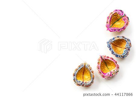 Happy Diwali - Clay Diya lamps lit during Dipavali Happy Diwali - Clay Diya lamps lit during Dipavali 44117866