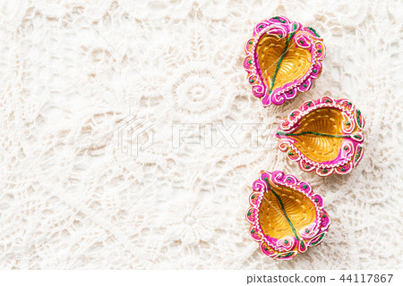 Happy Diwali - Clay Diya lamps lit during Dipavali 44117867