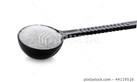 monosodium glutamate in spoon on white background 44119516
