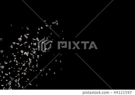 Split debris of stone exploding against black 44121597