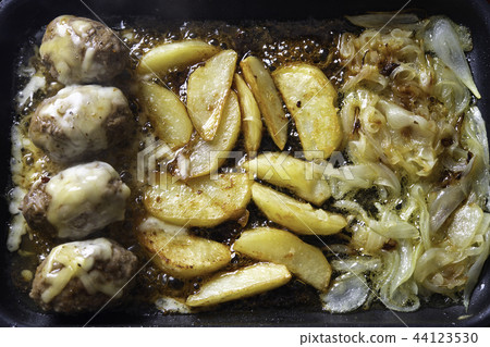 Cheese hamburger with potato and onion slices Cheese hamburger with potato and onion slices 44123530