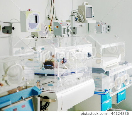 Newborn baby in hospital incubator Newborn baby in hospital incubator 44124886