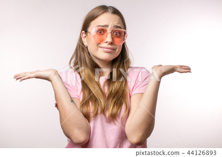 indiffereny emotional girl gesturing at the camera indiffereny emotional girl gesturing at the camera 44126893