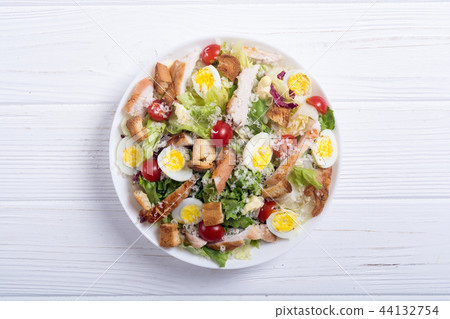 Salad ceasar with chicken , eggs and tomatoes Salad ceasar with chicken , eggs and tomatoes 44132754