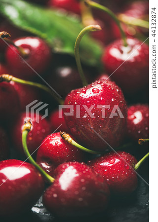 Fresh wet sweet cherries texture, wallpaper and background, close-up Fresh wet sweet cherries texture, wallpaper and background, close-up 44132874