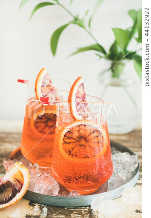 Aperol Spritz cocktail drink with orange and ice in glasses 44132922