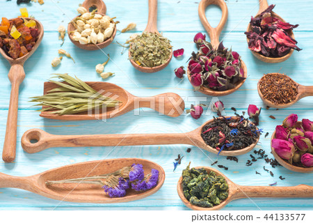 different kinds of tea in wooden spoons 44133577