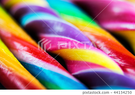candy canes of different colors of the rainbow 44134250