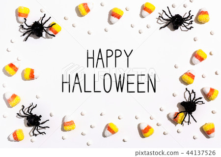 Happy Halloween message with spiders overhead view Happy Halloween message with spiders overhead view 44137526
