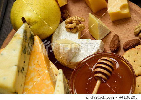 Various types of cheese on a rustic table Various types of cheese on a rustic table 44138203