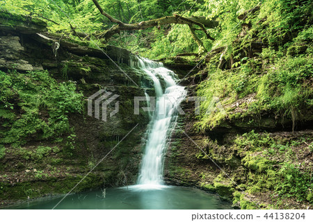 High mountain waterfall High mountain waterfall 44138204
