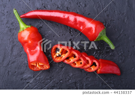 CloseUp top view red chili pepper with sliced, raw food ingredient concept 44138337