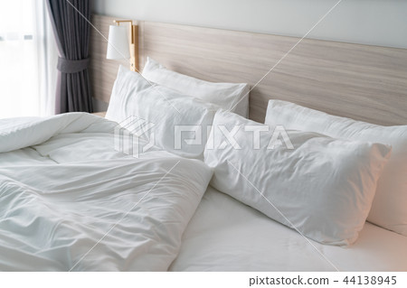 modern bedroom with wooden bed 44138945