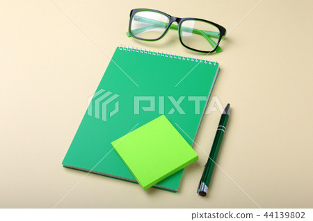 Business accessories on desktop: notebook, diary, fountain pen, glasses. Macro with blur and soft 44139802