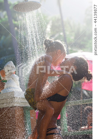 Mother with her son are taking shower 44139877