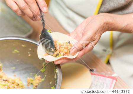Making dumplings Making dumplings 44143572
