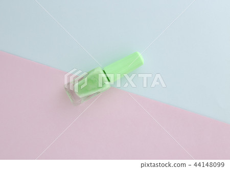 Light green nail polish on blank paper with  44148099