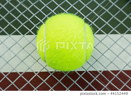 The tennis ball on racket The tennis ball on racket 44152449