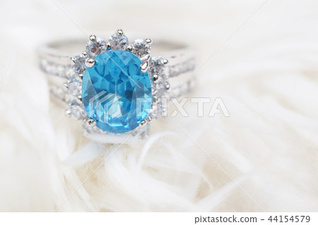 diamond ring and blue gemstone 44154579