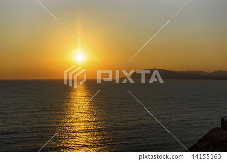 Beautiful sunset on smooth Black sea in summer Beautiful sunset on smooth Black sea in summer 44155163