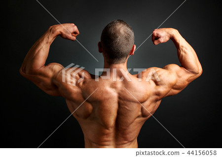 Young bodybuilder man flexing back double bicpes 44156058