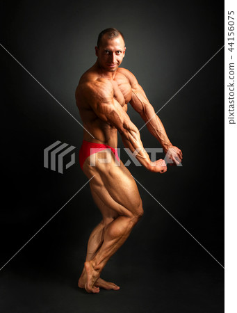 Studio shot of male bodybuilder posing, Studio shot of male bodybuilder posing, 44156075