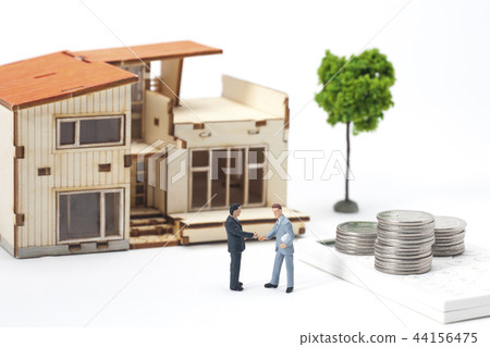 Real estate concept: miniature businessman with house and coin and calculator Real estate concept: miniature businessman with house and coin and calculator 44156475