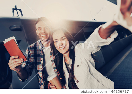 Positive girl and man doing photo outside 44156717