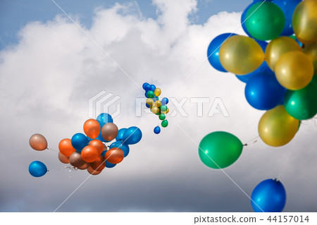 bundles of balls of blue, yellow, red and green 44157014