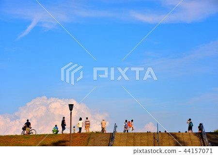 People watching surfers on Sagami River embankment 44157071