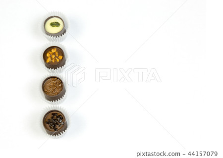 Chocolate candies on a white background, isolate. 44157079