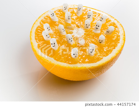 Funny capsules with vitamins from half an orange. Funny capsules with vitamins from half an orange. 44157174