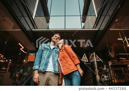 Cheerful lady expressing love for satisfied male 44157268