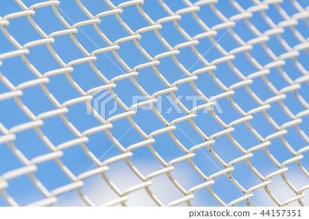 White fence with blue sky White fence with blue sky 44157351