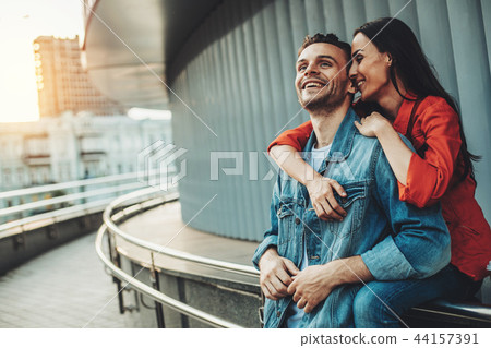 Happy woman talking with glad male outside 44157391