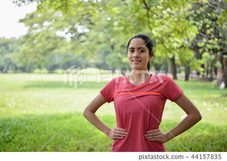 Exercise concept. Beautiful girl is stretching her muscles. Beau 44157835