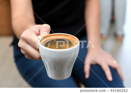 Coffee white cup sent from hand women. Coffee white cup sent from hand women. 44160262