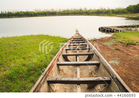 Boat parking at the coast into the lake at dawn 44160893