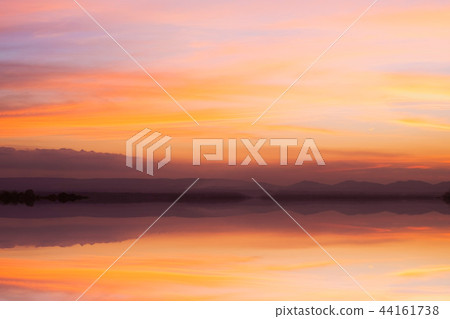 bright orange sky and light of sunset background. bright orange sky and light of sunset background. 44161738
