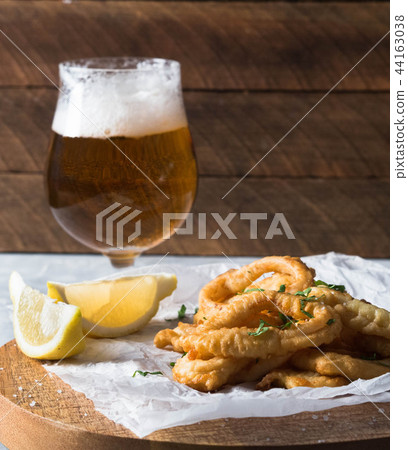 Homemade breaded fried calamari with lemon Homemade breaded fried calamari with lemon 44163038