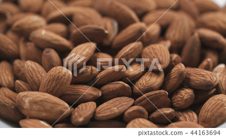 closeup roasted almonds background closeup roasted almonds background 44163694